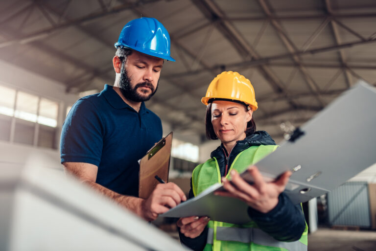 Worker and Surveyor Signing Documents